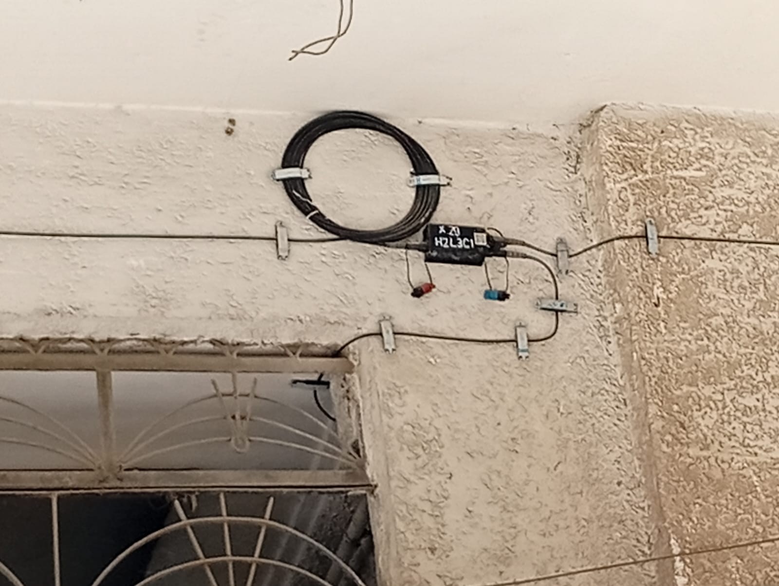 Fiber loop secured near building services