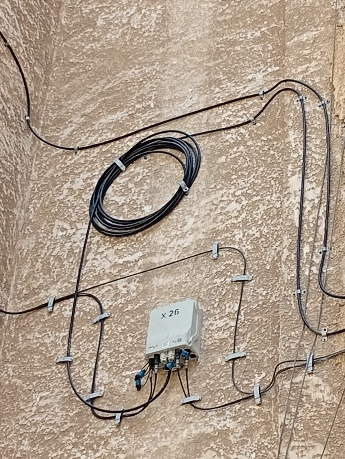 Fiber service loop and mounted X-BOX